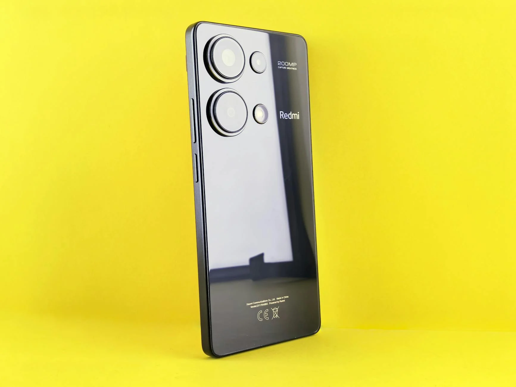 Stylish smartphone on a yellow backdrop for a modern tech look.
